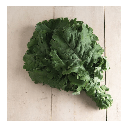 Photo of a bunch of white russian kale leaves on a light brown wood cutting board.